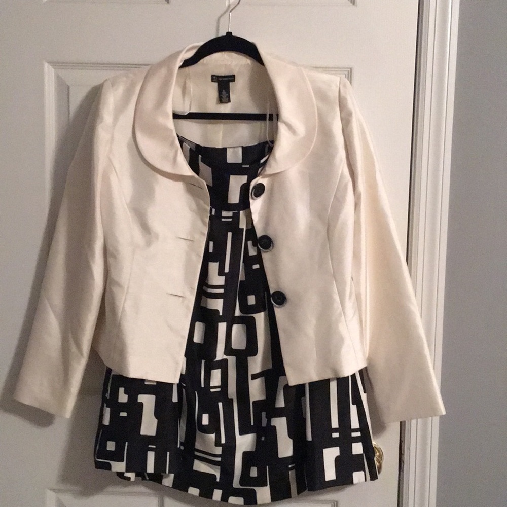 Cream and black business suit